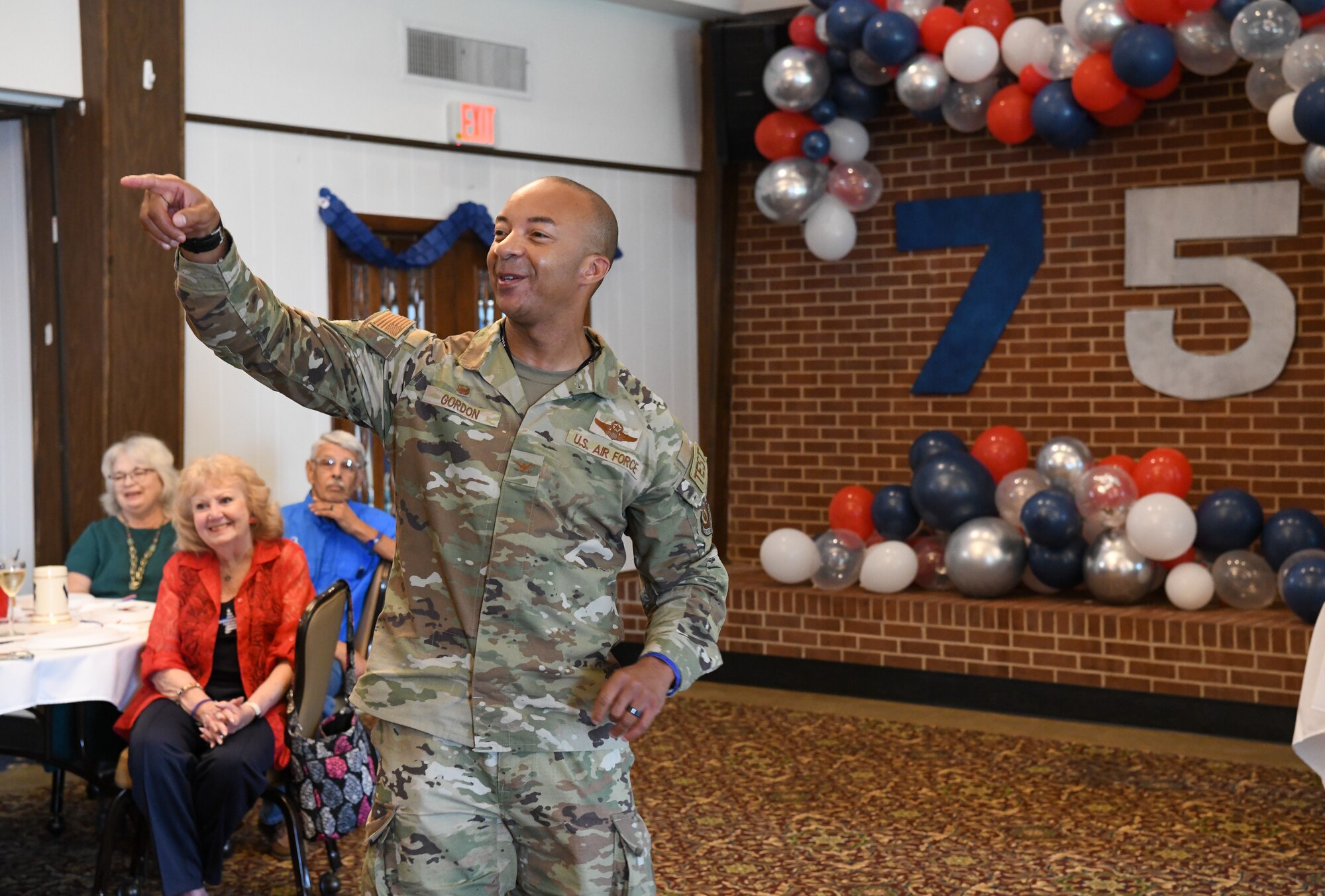 Airman pointing while speaking