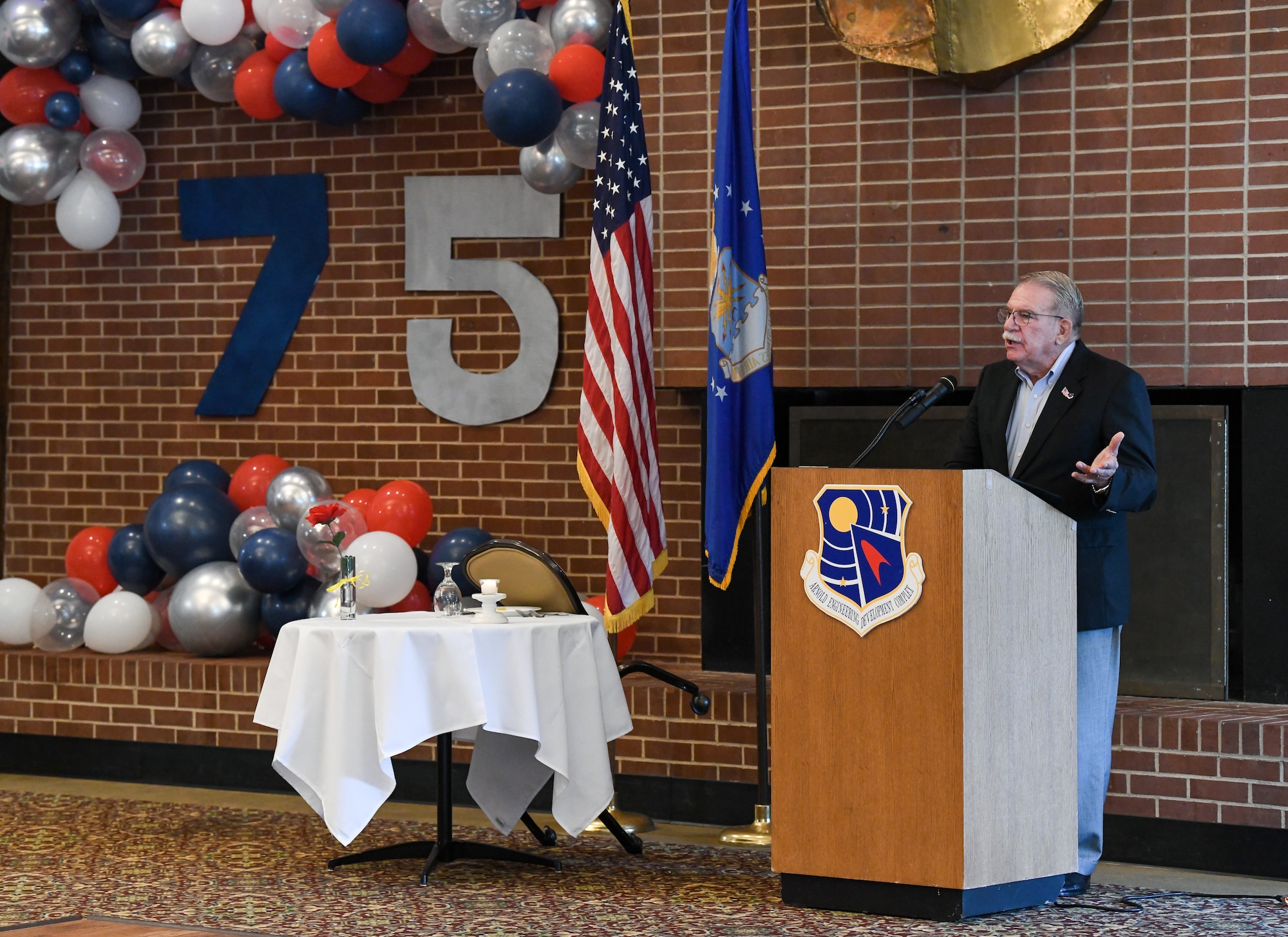 Man at a lectern speaking