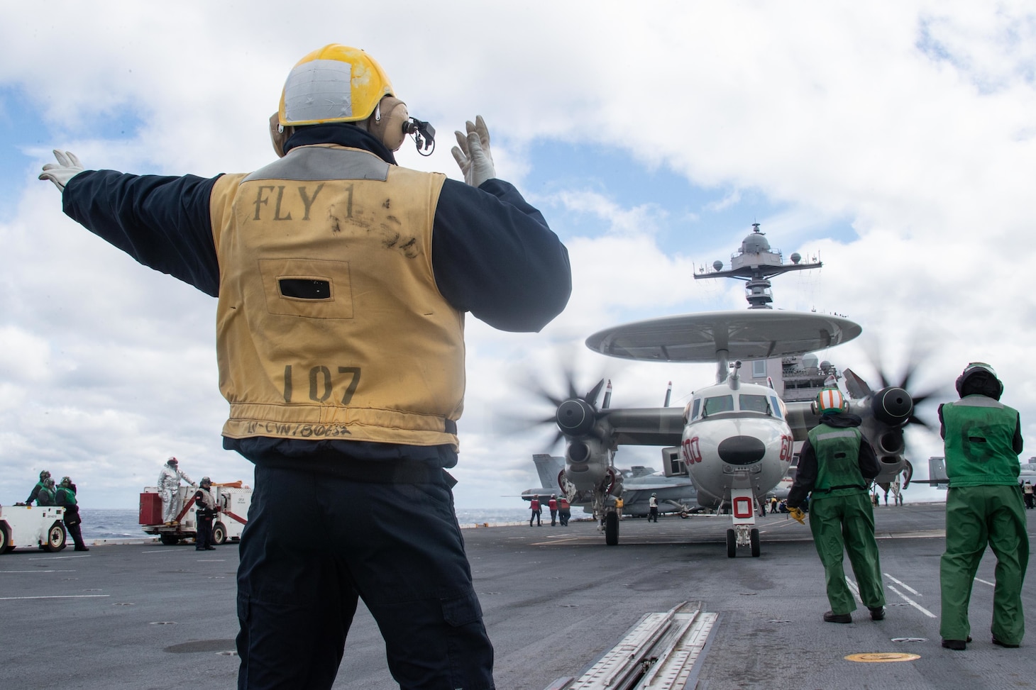 Sailors assigned to USS Gerald R. Ford’s (CVN 78) air department direct an E2-D Hawkeye, attached to the "Bear Aces" of Airborne Command and Control Squadron (VAW) 124, on the flight deck, March 29, 2022. Ford is underway in the Atlantic Ocean conducting flight deck certification and air wing carrier qualification as part of the ship’s tailored basic phase prior to operational deployment.