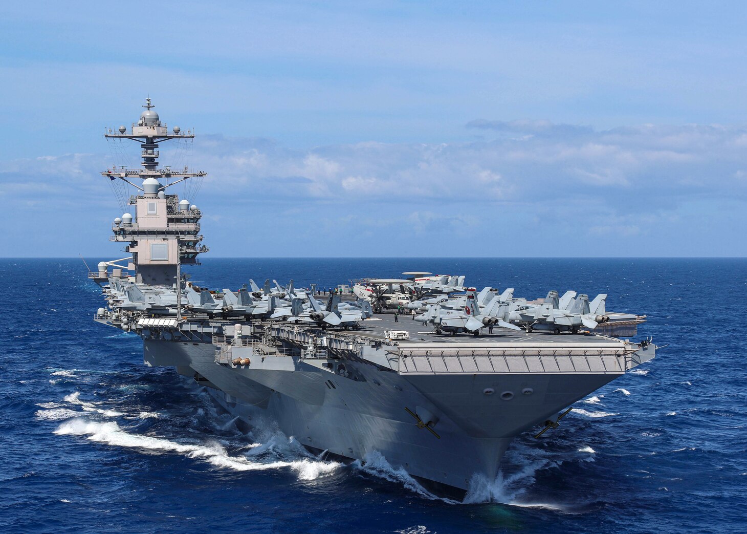 Aircraft attached to Carrier Air Wing (CVW) 8 sit on USS Gerald R. Ford's (CVN 78) flight deck as the ship steams through the Atlantic Ocean, April 13, 2022. Ford is underway conducting carrier qualifications and strike group integration prior to operational deployment.