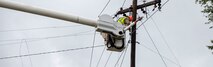 Utility workers with JCL Power Boyce L.A., repair damaged power lines on Marine Corps Air Station New River, N.C., Sept. 16, 2018. Hurricane Florence impacted Marine Corps Base Camp Lejeune and MCAS New River with periods of strong winds, heavy rains, flooding of urban and low lying areas, flash floods and coastal storm surges.  (U.S. Marine Corps photo by Lance Cpl. Damaris Arias). Cropped version of 180916-M-KW786-015