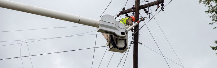 Utility workers with JCL Power Boyce L.A., repair damaged power lines on Marine Corps Air Station New River, N.C., Sept. 16, 2018. Hurricane Florence impacted Marine Corps Base Camp Lejeune and MCAS New River with periods of strong winds, heavy rains, flooding of urban and low lying areas, flash floods and coastal storm surges.  (U.S. Marine Corps photo by Lance Cpl. Damaris Arias). Cropped version of 180916-M-KW786-015