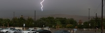A bolt of lightning flashes over the hills of Barstow, Calif., Aug. 19, during a heavy rain storm that brought thunder, lightning and flash flooding. As a result of the storm, communities in Barstow were left without power and flooded streets. Cropped version of 130819-M-ss662-004