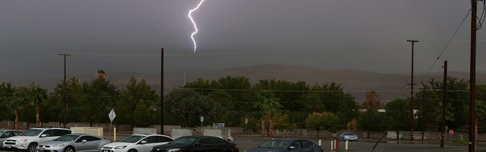 A bolt of lightning flashes over the hills of Barstow, Calif., Aug. 19, during a heavy rain storm that brought thunder, lightning and flash flooding. As a result of the storm, communities in Barstow were left without power and flooded streets. Cropped version of 130819-M-ss662-004