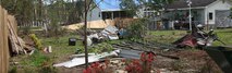 A photo of a backyard days after an F-2 tornado hit the Falcon Bridge housing community April. 16. Cropped version of 110420-M-EY704-013