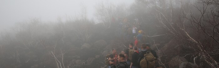 Marines and sailors with Special-Purpose Marine Air-Ground Task Force Africa 14 hike up a trail on Mt. Etna, Italy, April 26, 2014. The service members hiked up the volcano in observance of Earth Day. Cropped version of 140426-M-RW232-037