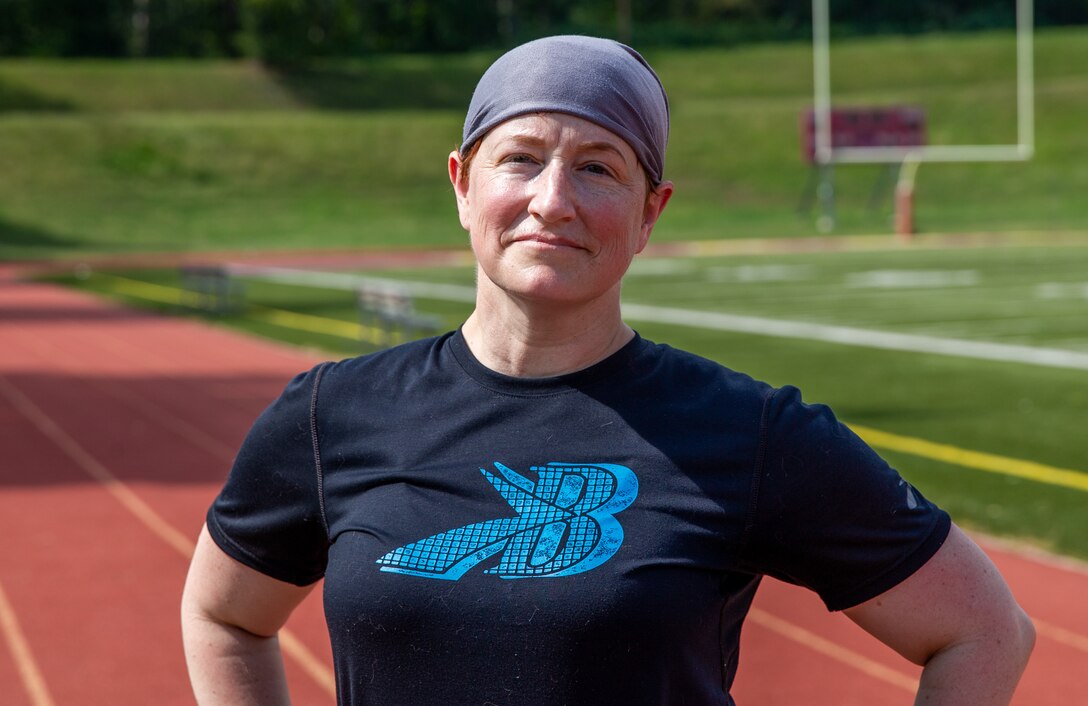 U.S. Marine Corps Gunnery Sgt. Nancy Wright, retired, poses for a photo at Butler Stadium on Marine Corps Base Quantico, Virginia, Sept. 19, 2022. Wright will be running in the upcoming Marine Corps Marathon.  (US Marine Corps photo by Lance Cpl. Kayla LeClaire)