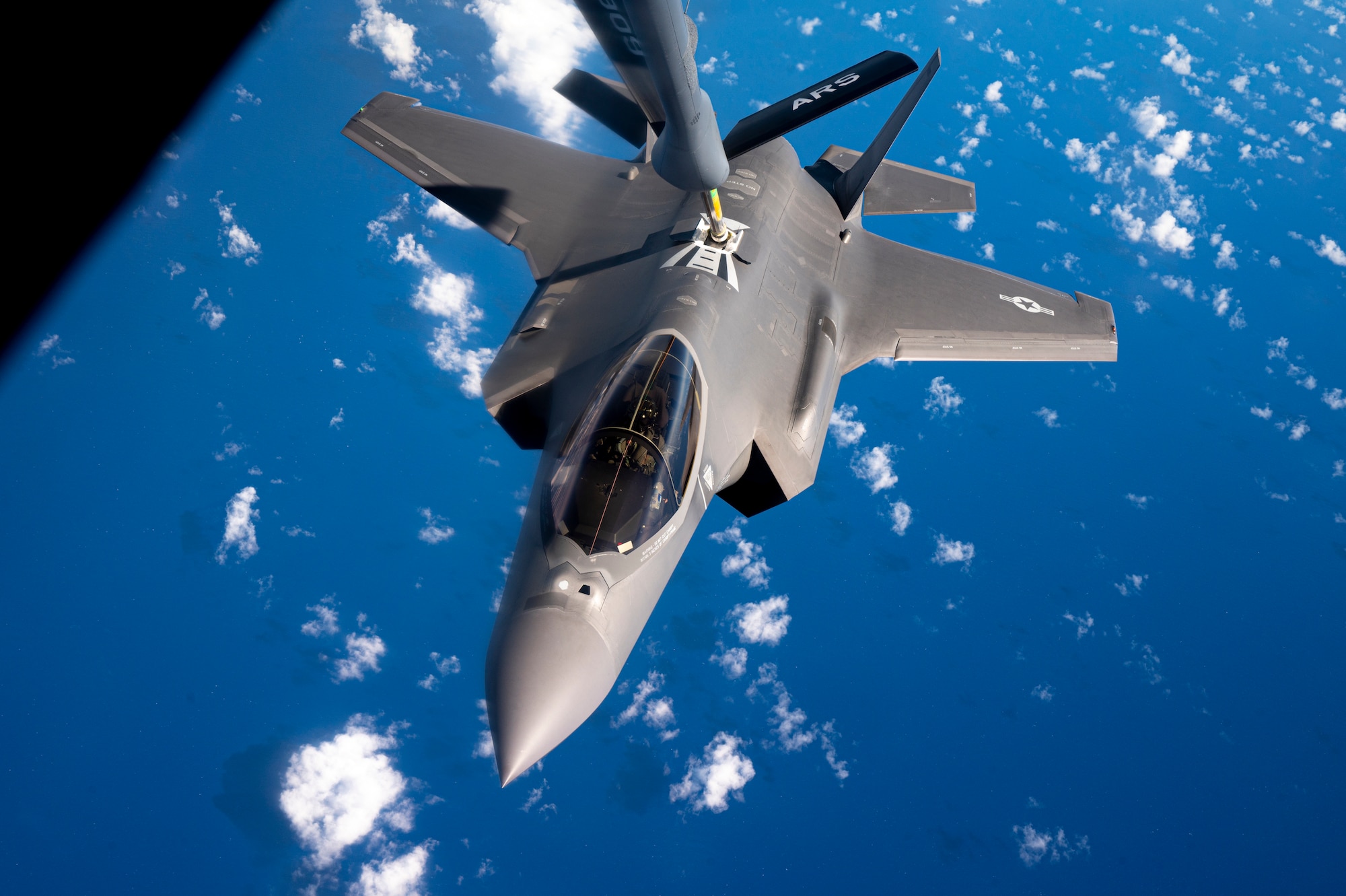 A U.S. Air Force F-35A Lightning II pilot assigned to the 421st Fisgter Squadron, Hill Air Force Base, Utah, receives fuel from a U.S. Air Force KC-135 Stratotanker aircraft assigned to the 506th Expeditionary Air Refueling Squadron, Andersen Air Force Base, Guam, over the Pacific Ocean, while conducting Agile Combat Employment (ACE) rehearsals, June 28, 2022.