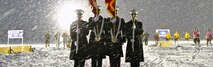 Marines From Recruiting Station Lansing, Recruiting Sub-Stations Grand Rapids North and South, participate in the opening ceremony for the Grand Rapids Pond Hockey Classic, Jan 25. The Marines braved sub-zero wind chill temperatures to present the colors on the frozen surface of Reeds Lake in Grand Rapids, Mich. Cropped version of 130125-M-KN493-166