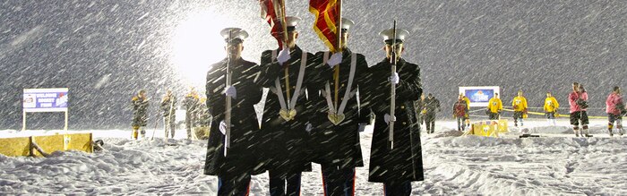 Marines From Recruiting Station Lansing, Recruiting Sub-Stations Grand Rapids North and South, participate in the opening ceremony for the Grand Rapids Pond Hockey Classic, Jan 25. The Marines braved sub-zero wind chill temperatures to present the colors on the frozen surface of Reeds Lake in Grand Rapids, Mich. Cropped version of 130125-M-KN493-166