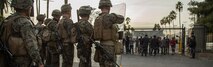 U.S. Marines with 1st Platoon, Company “F”, 2nd Battalion, 1st Marine Regiment, and 1st Combat Engineer Battalion, attached to the 13th Marine Expeditionary Unit, reinforce a simulated U.S. Embassy against protesters at the Maritime Law Enforcement Training Center, Los Angeles, Calif., during their Certification Exercise (CERTEX), Dec. 8, 2015. Embassy reinforcement is a mission the MEU is specifically trained for. CERTEX will test the unit’s ability to complete each of its mission essential tasks and determine if the unit is prepared to deploy. (U.S. Marine Corps photo by Sgt Hector de Jesus/RELEASED) Cropped version of 151208-M-PC554-184
