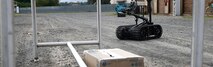 The Talon, an Explosive Ordnance Disposal (EOD) robot, provides visuals to a simulated improvised explosive device (IED) call during a simulated Continental United States IED training, Marine Corps Training Area Bellows, Feb. 21, 2019. EOD conducts this annual training to maintain their readiness. The Maine Corps Base Hawaii EOD team not only supports missions overseas, they work with and assist federal and local law enforcement agencies operations. (U.S. Marine Corps photo by Lance Cpl. Porfirio Gonzalez). Cropped version of 190221-M-KV127-1002