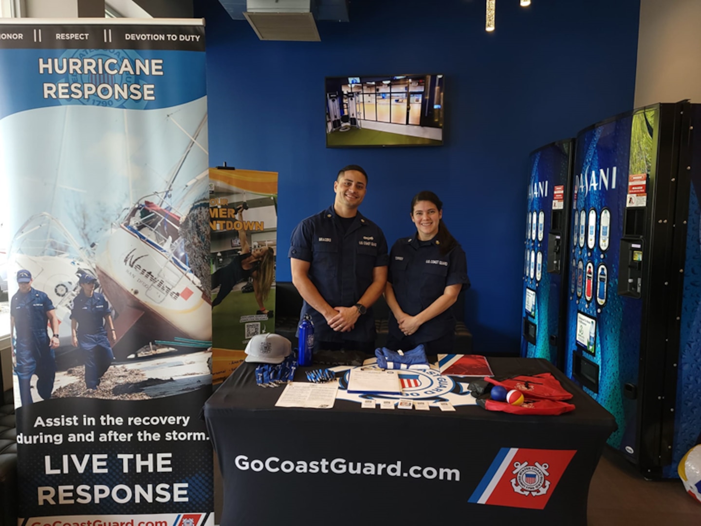 Petty Officer 2nd Class Nathaniel Bracero and Petty Officer 2nd Class Neisha Torres recruiting for the Coast Guard at an event in Puerto Rico during the week of June 21, 2022. The couple, who grew up in Puerto Rico, put together and hosted a week-long series of recruiting events in their home country. (U.S. Coast Guard photo.)