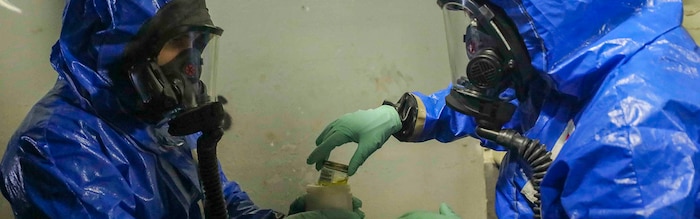 190510-M-YD783-2168 ARABIAN SEA (MAY 10, 2019) U.S. Marine Sgt. Michael Chiarappa, left, and Cpl. Haley Brunette, Chemical, Biological, Radiological and Nuclear defense specialists with the 22nd Marine Expeditionary Unit, store a sample collected during scenario based reconnaissance and sampling training in the well deck of the Wasp-class amphibious assault ship USS Kearsarge (LHD-3). The CBRN Marines conducted the training to maintain combat readiness standards and sharpen their skills. Marines and Sailors with the 22nd MEU and Kearsarge Amphibious Ready Group are deployed to the 5th Fleet area of operations in support of naval operations to ensure maritime stability and security in the Central Region, connecting the Mediterranean and the Pacific through the western Indian Ocean and three strategic choke points. (U.S. Marine Corps photo by Cpl. Tawanya Norwood/Released) Cropped version of 190510-M-YD783-2168