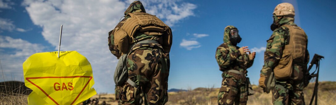 Marines go through a simulated decontamination center after a scenario simulating a chemical attack March 13 during Dragon Fire Exercise 15-2 at Pohakuloa Training Area. The Marines are with Headquarters Battery, 12th Marine Regiment, 3rd Marine Division, III Marine Expeditionary Force. (U.S. Marine Corps photo by Lance Cpl. William Hester/ Released) Cropped version of 150314-M-XX123-417