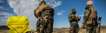 Marines go through a simulated decontamination center after a scenario simulating a chemical attack March 13 during Dragon Fire Exercise 15-2 at Pohakuloa Training Area. The Marines are with Headquarters Battery, 12th Marine Regiment, 3rd Marine Division, III Marine Expeditionary Force. (U.S. Marine Corps photo by Lance Cpl. William Hester/ Released) Cropped version of 150314-M-XX123-417