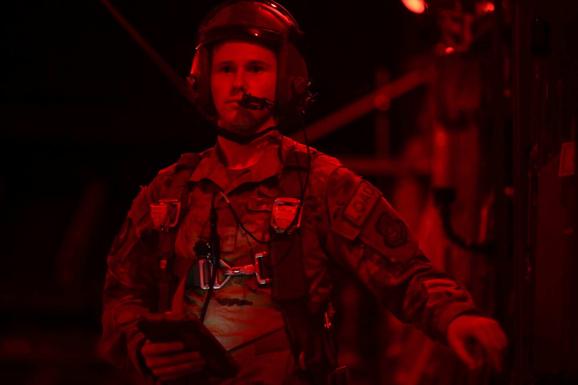 U.S. Air Force Senior Airman Andrew Girard, 535th Airlift Squadron loadmaster, readies to release cargo from a C-17 Globemaster III assigned to the 15th Operations Group during a bilateral exercise with Japan Air Self-Defense Force 403rd Tactical Airlift Squadron members around the Hawaiian Islands, Sept. 28, 2022. JASDF joined PACAF’s 535th AS, participating in a 3-day bilateral exercise and familiarizing aircrew from both services on the capabilities of the Kawasaki C-2 and the C-17. (U.S. Air Force photo by Staff Sgt. Alan Ricker)