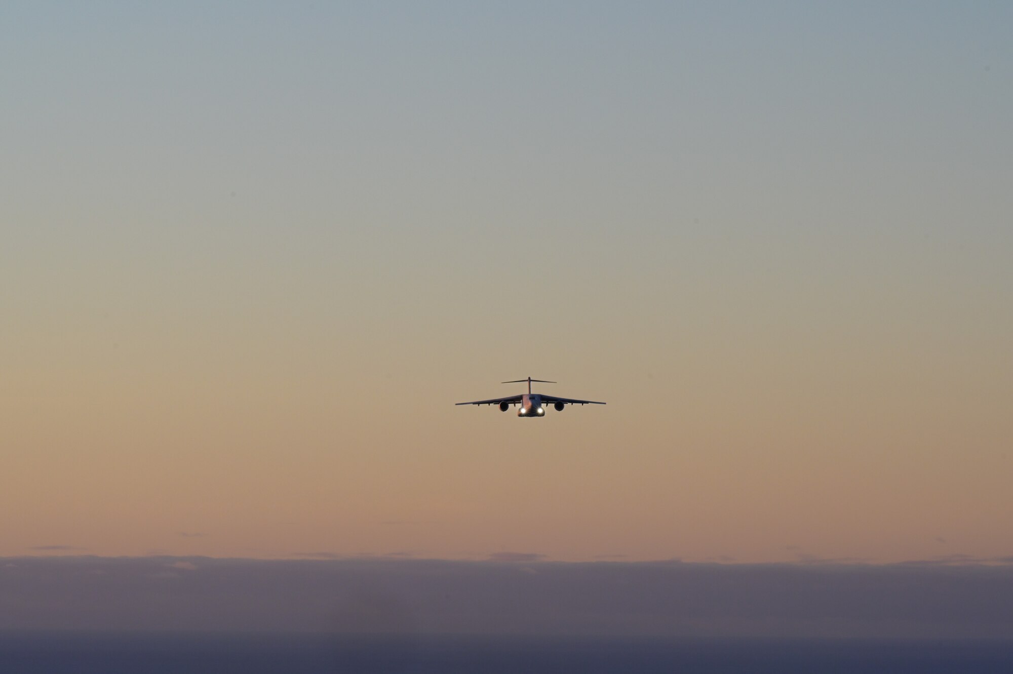 A Kawasaki C-2, assigned to the Japan Air Self-Defense Force 403rd Tactical Airlift Squadron, flies in formation with a C-17 Globemaster III, assigned to the 15th Operations Group, during a bilateral exercise around the Hawaiian Islands, Sept. 28, 2022. The exercise was held to strengthen partnerships with allies and increase interoperability for future operations between the JASDF and the 15th Wing. (U.S. Air Force photo by Staff Sgt. Alan Ricker)