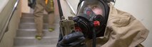 Cpl. Albert Gaston, a chemical, biological, radiological and nuclear (CBRN) defense specialist with the CBRN response element (CRE), 31st Marine Expeditionary Unit, relays a report while inspecting a building for mock contamination during CBRN response training at Camp Hansen, Okinawa, Japan, Feb. 1, 2017. The CRE conducted full scale detection and decontamination training with Marine Corps Installations Pacific - Fire and Emergency Services personnel observing. As the Marine Corps’ only continuously forward-deployed unit, the 31st MEU air-ground-logistics team provides a flexible force, ready to perform a wide range of military operations, from limited combat to humanitarian assistance operations, throughout the Indo-Asia Pacific region. (U.S. Marine Corps photo by Cpl. Darien J. Bjorndal/ Released) Cropped version of 170201-M-MF313-114