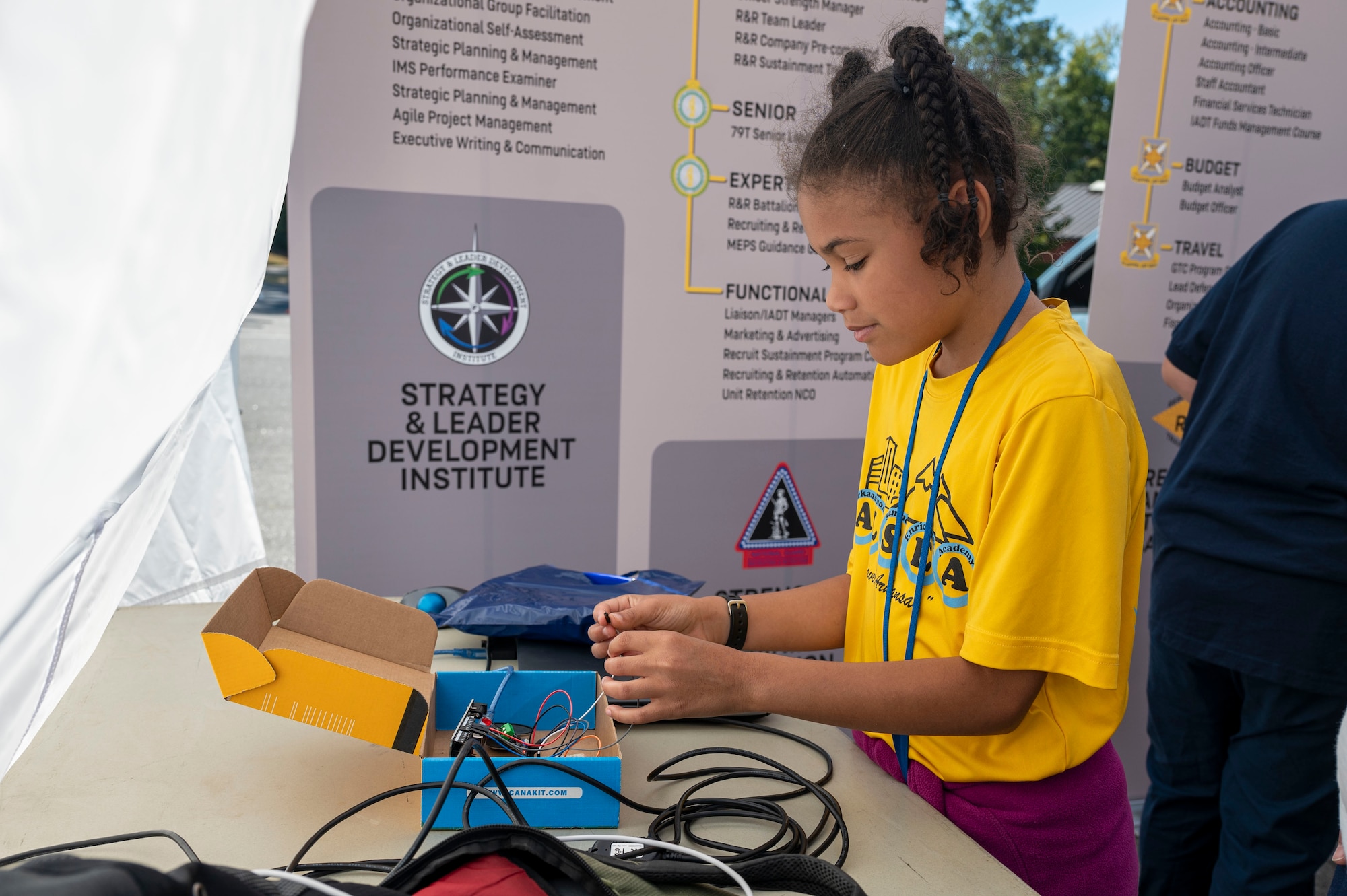 A child interacts with a display