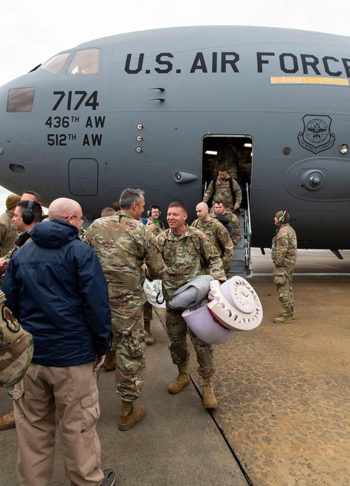 Members from the 3rd Airlift Squadron, 436th Security Forces Squadron and 436th Mission Generation Group are greeted by family, fellow squadron and Team Dover members at Dover Air Force Base, Delaware, Oct. 3, 2022. Team Dover members returned to Dover after a four-month deployment to Al Udeid Air Base, Qatar. The C-17 Globemaster III, operated by 3AS, is capable of rapid strategic delivery of troops and all types of cargo to main operating bases or directly to forward bases in a deployment area. (U.S. Air Force photo by Roland Balik)