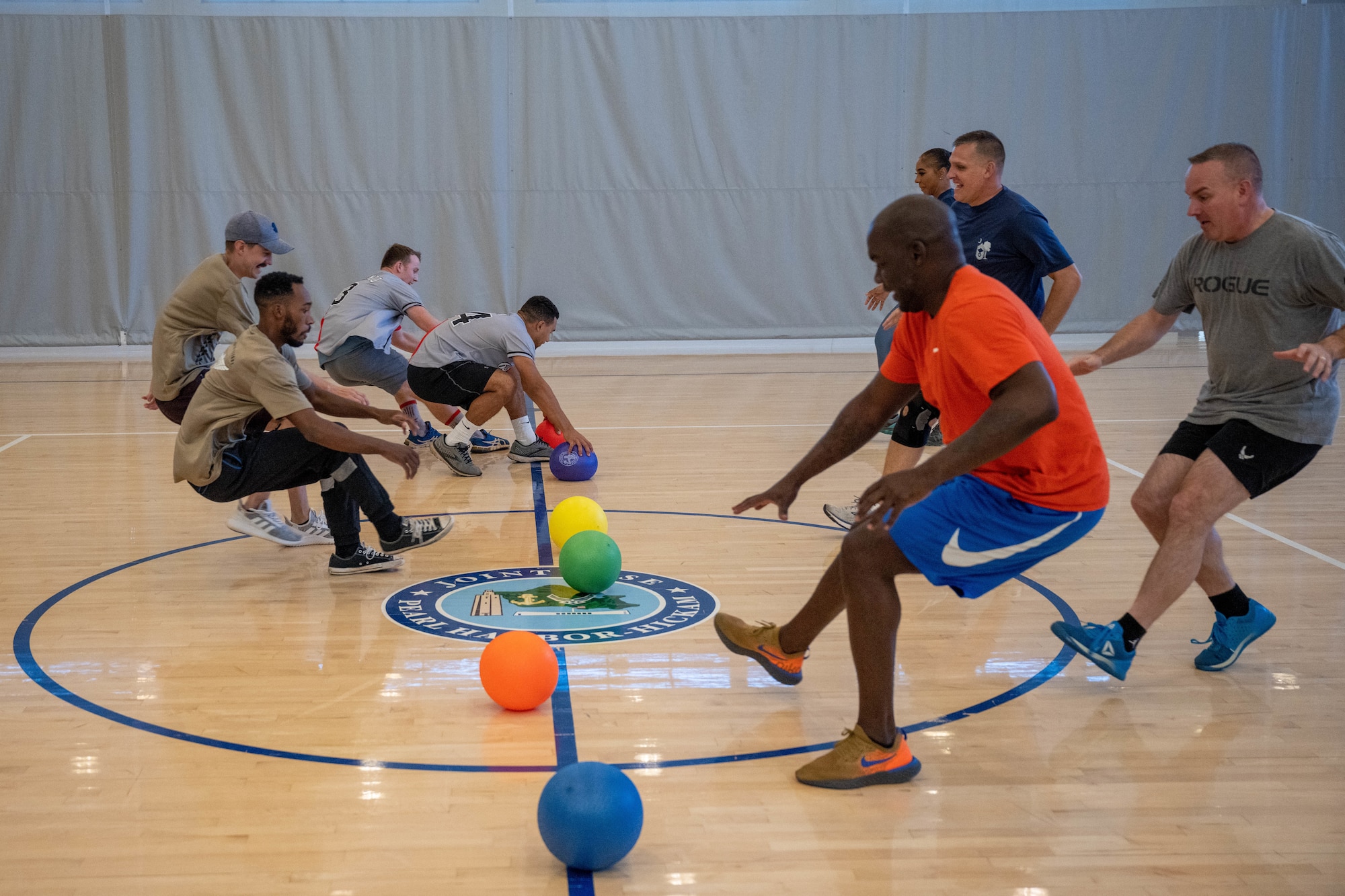 Airmen participate in a dodgeball tournament at Joint Base Pearl Harbor-Hickam, Hawaii, Sept. 30, 2022. 15th Wing Violence Prevention Office invited Hickam Airmen to partake in the tournament to raise awareness for Suicide Prevention Month. (U.S. Air Force photo by Senior Airman Makensie Cooper)