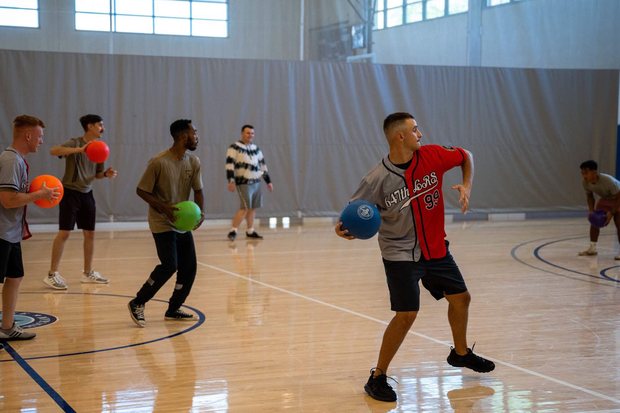 Airmen participate in a dodgeball tournament at Joint Base Pearl Harbor-Hickam, Hawaii, Sept. 30, 2022. 15th Wing Violence Prevention Office invited Hickam Airmen to partake in the tournament to raise awareness for Suicide Prevention Month. (U.S. Air Force photo by Senior Airman Makensie Cooper)