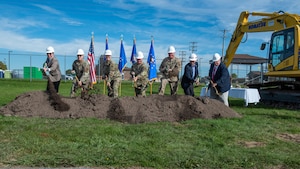 914th leadership and distinguished guests ceremonially throw the first shovels of dirt to break ground on the NFARS main gate project.