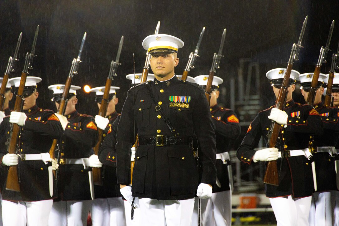 U.S. Marines with the Marine Corps Silent Drill Platoon perform at halftime during the Toms River North vs. Toms River South Great American Rivalry Series football game in Toms River, New Jersey, Sept. 30, 2022. The Marine Corps Silent Drill Platoon is a 24-man  rifle platoon that performs a unique precision drill exhibition. (U.S. Marine Corps photo by Sgt. James A. Guillory)