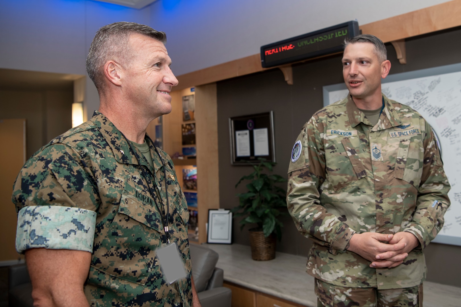 Two military men speak to eachother
