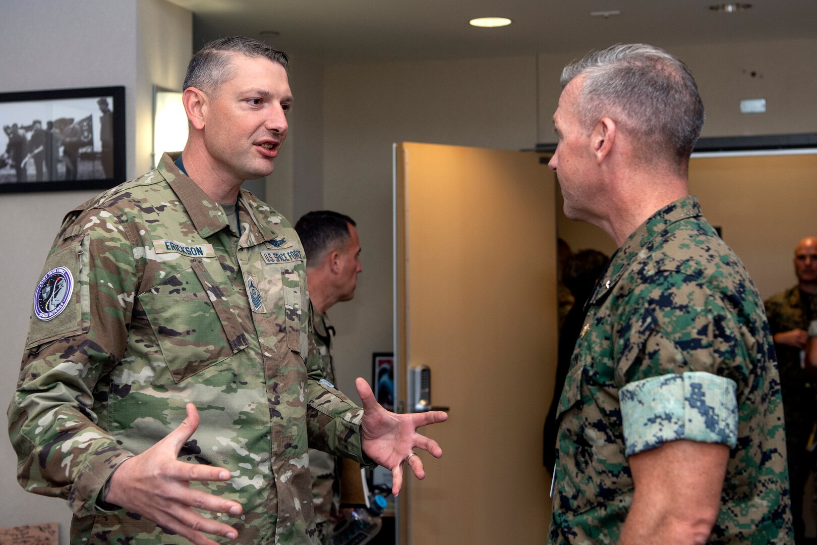 Two military men speaking to eachother