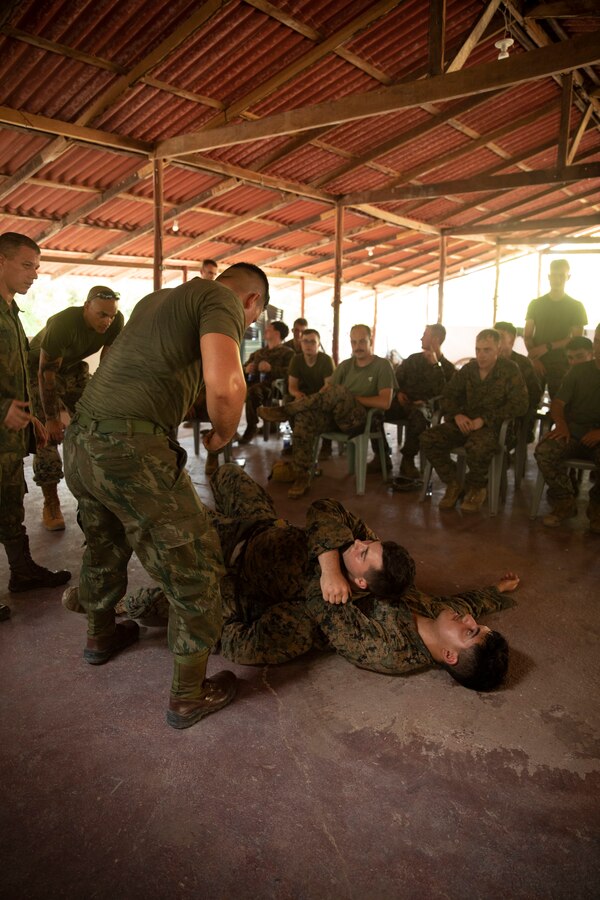 U.S. Marines and Sailors with 2d Battalion, 2d Marine Regiment, 2d Marine Division, demonstrate a Brazilian tactic for carrying casualties during a first aid class as part of a bilateral jungle training event in Manaus, Brazil, Sept. 26, 2022. U.S. partnerships in the U.S. Southern Command area of responsibly are forged by shared challenges and common objectives. Bilateral training events such as jungle training develops and sustains relationships that improve the capacity of U.S. and partner nation maritime forces to achieve common desired effects. This exchange of knowledge between critical regional partners fosters interoperability, friendly relationships, and mutual cooperation. (U.S. Marine Corps photo by Sgt. Camila Melendez)