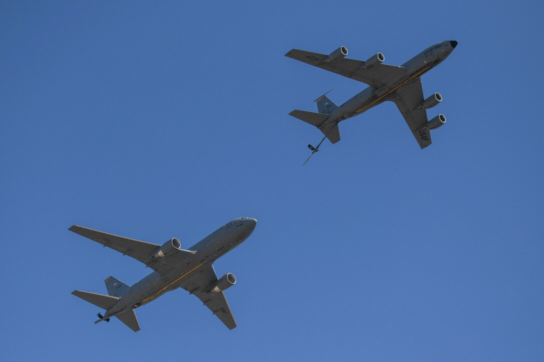 A KC-135 Stratotanker holds a refueling position with a KC-46 Pegasus during a flyover at the Red River Thunder airshow at Altus Air Force Base (AAFB), Oklahoma, Oct. 1, 2022. All three of AAFB’s airframes, the KC-135, the KC-46, and the C-17 Globemaster III were part of the airshow. (U.S. Air Force photo by Senior Airman Kayla Christenson)