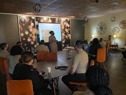 Master Chief Legalman (Surface Warfare / Air Warfare) Tiffany George addresses Region Legal Service Office Southeast Sailors.