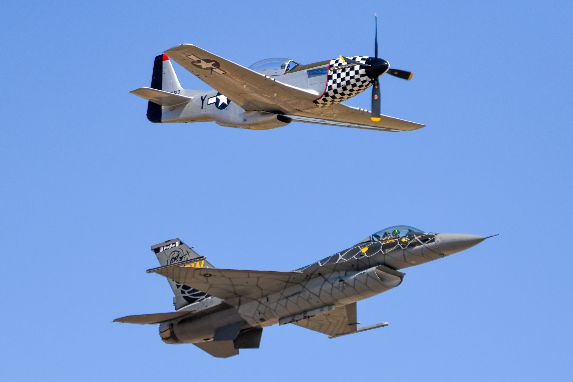 The P-51 Mustang and the F-16 Fighting Falcon fly a heritage flight during the Red River Thunder airshow at Altus Air Force Base, Oklahoma, Oct. 1, 2022. The Viper Demonstration Team includes an F-16 known as “Viper” flown by Capt. Aimee ‘Rebel’ Fiedler, supported by nine other Airmen on the team. (U.S. Air Force photo by Senior Airman Kayla Christenson)