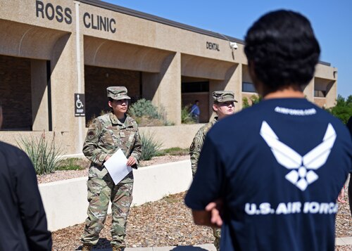 U.S. Air Force Senior Airman Jennifer Lopez, 17th Operational Medical Readiness Squadron public health technician, listens to questions from delayed entry program members at the Ross Clinic, Goodfellow Air Force Base, Sept. 29, 2022. Lopez led a tour of the 17th MDG, showing potential recruits what jobs they might be eligible for them through enlistment in the Air Force.  (U.S. Air Force photo by Airman 1st Class Sarah Williams)