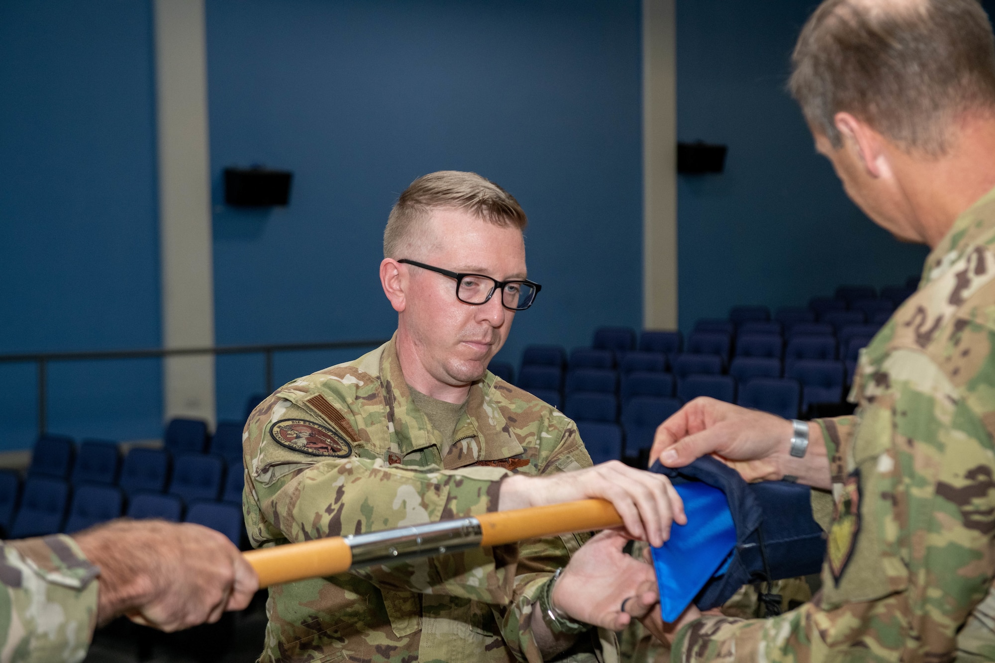U.S. Air Force Maj. Gen. Corey Martin (right), 18th Air Force Commander (right) and Lt. Col. Daniel Naske (left), 816th Expeditionary Airlift Squadron Commander, case the unit’s colors during an inactivation ceremony Sept. 30, 2022 at Al Udeid Air Base, Qatar. The 816th EAS has been activated and inactivated multiple times in its history, which dates back as far as WWII. (U.S. Air National Guard photo by Airman 1st Class Constantine Bambakidis)