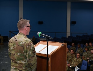 U.S. Air Force Lt. Col. Daniel Naske, 816th Expeditionary Airlift Squadron Commander, delivers his closing remarks to members of the 816th EAS during an inactivation ceremony Sept. 30, 2022 at Al Udeid Air Base, Qatar. Naske took command of the squadron in May 2022. (U.S. Air National Guard photo by Master Sgt. Michael J. Kelly)