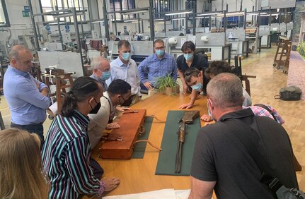 Paolo Santoni provides an overview of Beretta’s customized shotguns to members of Logistics Readiness Center Italy as well as representatives from U.S. Army Garrison Italy and Southern European Task Force-Africa. (courtesy photo)