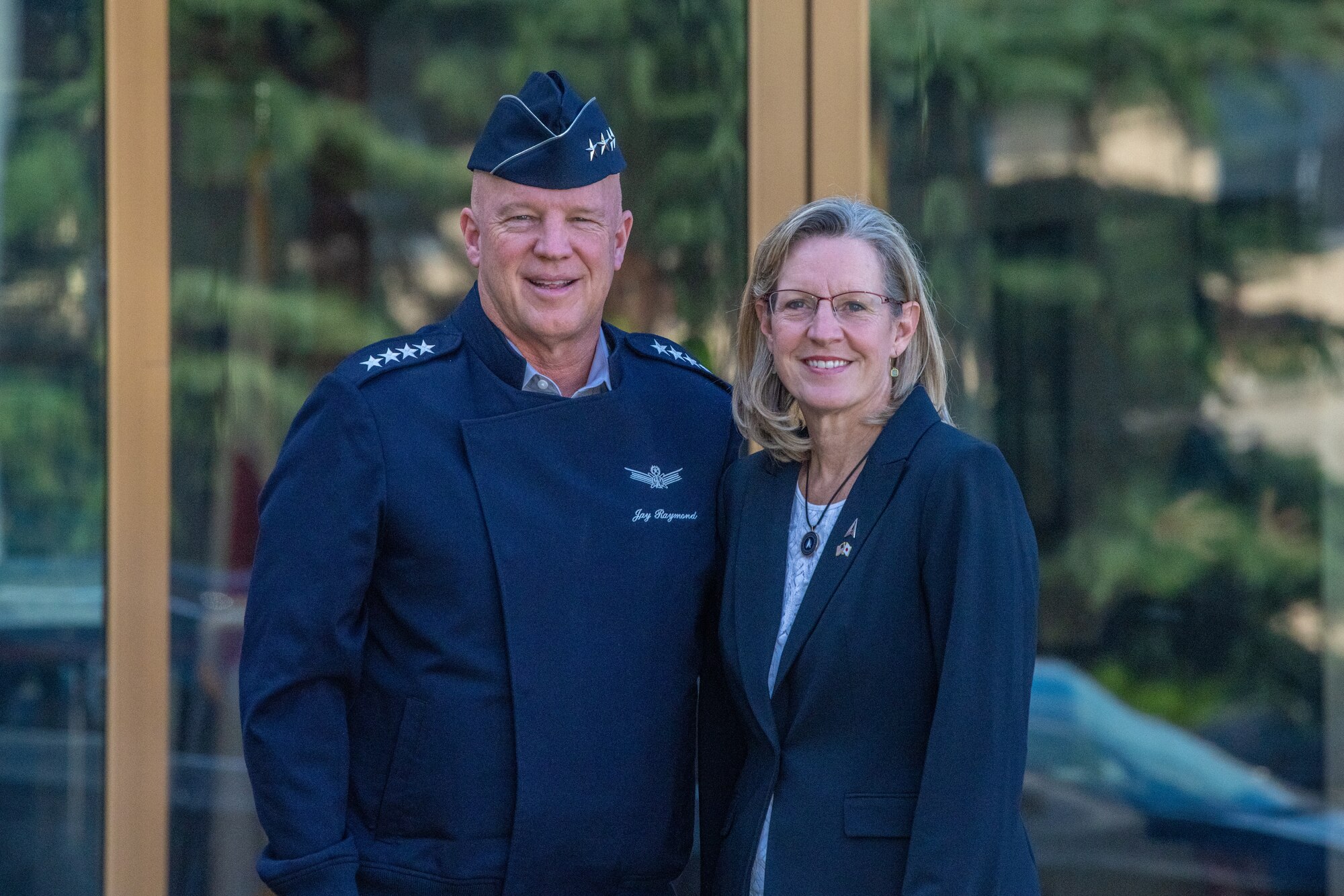 U.S. Space Force Gen. John "Jay" Raymond, Chief of Space
Operations, and wife Mollie Raymond pose for a photo outside of U.S. Forces Japan headquarters on Yokota Air Base, Japan, Oct. 4, 2022. Raymond visited Yokota to meet with Guardians and Airmen to emphasize the importance of operational readiness. (U.S. Air Force photo by Staff Sgt. Jessica Avallone)