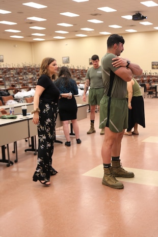 U.S. Army Combat Capabilities Development Command Soldier Center clothing designer Emily Madden evaluates the fit of a Marine wearing Marine Corps Systems Command’s redesigned physical training uniform prototype during a limited user evaluation at Marine Corps Base Quantico, Virginia, Sept. 13, 2022.