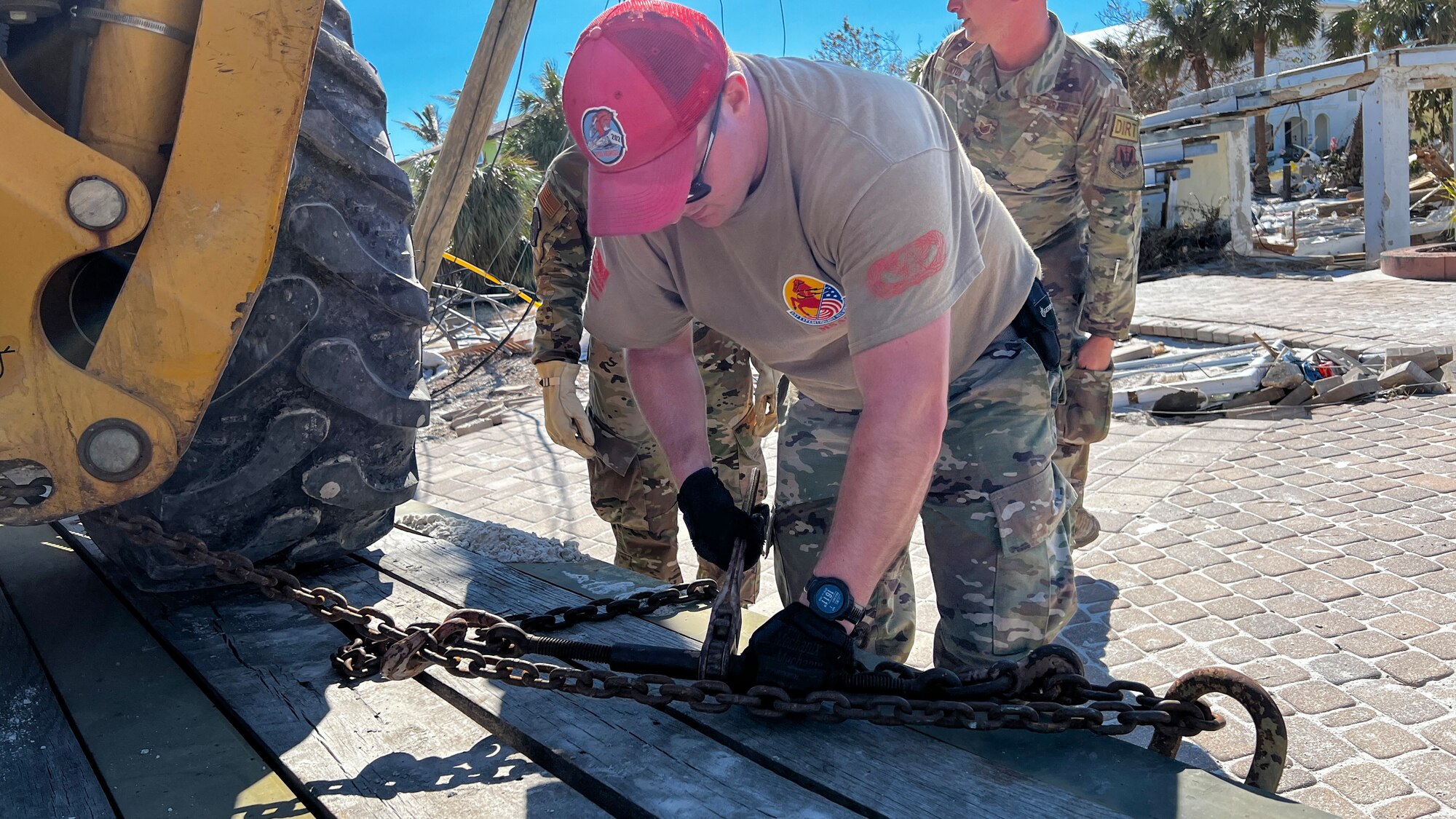 Members of the 202nd Rapid Engineer Deployable Heavy Operational Repair Squadron Engineers (RED HORSE) Squadron, Florida Air National Guard, clear roads in Fort Myers Beach, Florida, Oct. 1, 2022, after Hurricane Ian. The 202nd RED HORSE Squadron provides rapid response capabilities for worldwide contingencies and operations.