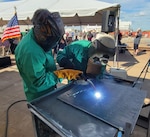 The keel of the next oceanographic survey ship (T-AGS 67) was ceremonially laid at Halter Marine in Pascagoula, MS, Oct. 4.  Here, Halter Marine welders etch names and the hull number into the keel plate.