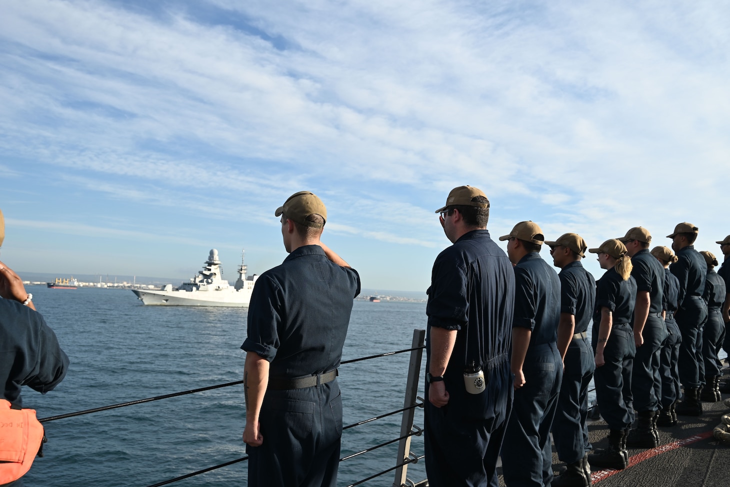 Sailors aboard Arleigh Burke-class guided missile destroyer USS Forrest Sherman (DDG 98) exchange honors with the Carlo Bergamini-class frigate ITS Carlo Bergamini (F 590) of the Italian Navy during a sea and anchor evolution into Taranto, Italy.