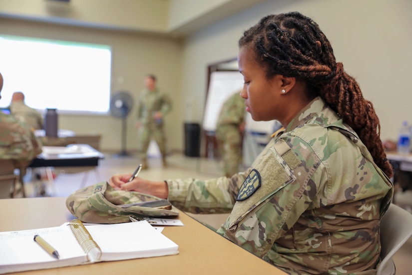 Col. Kelly Johnson, G3, 3rd Medical Command (Deployment Support), brings his unit's capabilities into focus during the U.S. Army Reserve Command Training Summit held 27-29 July, 2022 at the U.S. Army Civil Affairs and Psychological Operations headquarters, Fort Bragg, NC. (U.S. Army Reserve photo by Sgt. 1st Class Lisa M. Litchfield)