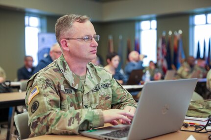 Col. Kelly Johnson, G3, 3rd Medical Command (Deployment Support), brings his unit's capabilities into focus during the U.S. Army Reserve Command Training Summit held 27-29 July, 2022 at the U.S. Army Civil Affairs and Psychological Operations headquarters, Fort Bragg, NC. (U.S. Army Reserve photo by Sgt. 1st Class Lisa M. Litchfield)