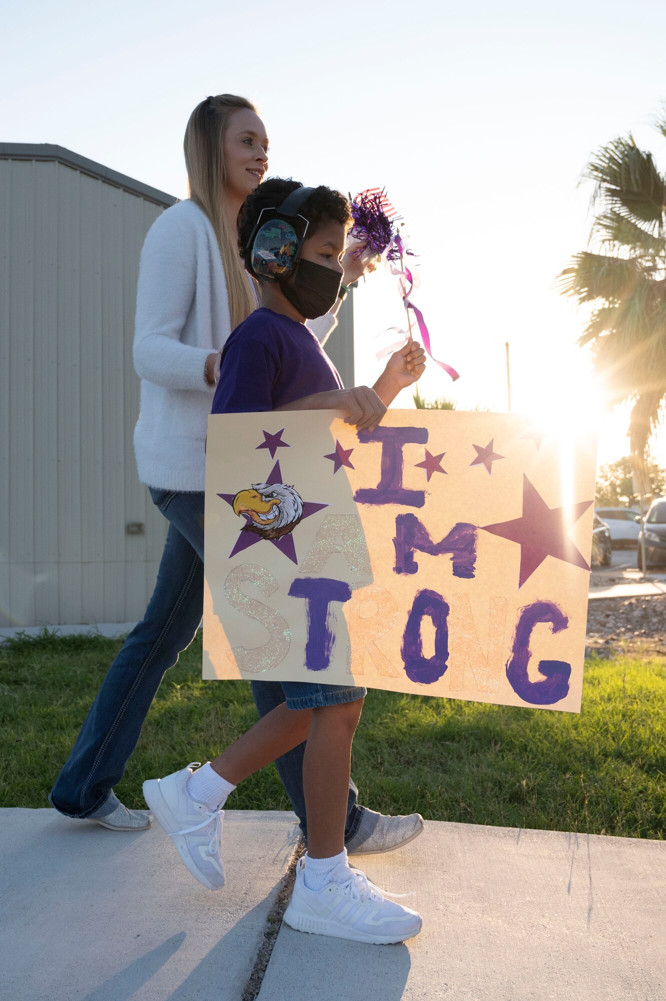 A student from the Roberto Bobby Barrera (RBB) Elementary School holds up a sign during the “Purple Parade” held at Laughlin Air Force Base, Texas, Sept. 29, 2022. The “Purple Parade” was held in celebration of RBB Elementary School receiving the Purple Star Award, recognizing the support and commitment the school provides to meeting the unique needs of military-connected students and their families. (U.S. Air Force photo by Airman 1st Class Kailee Reynolds)
