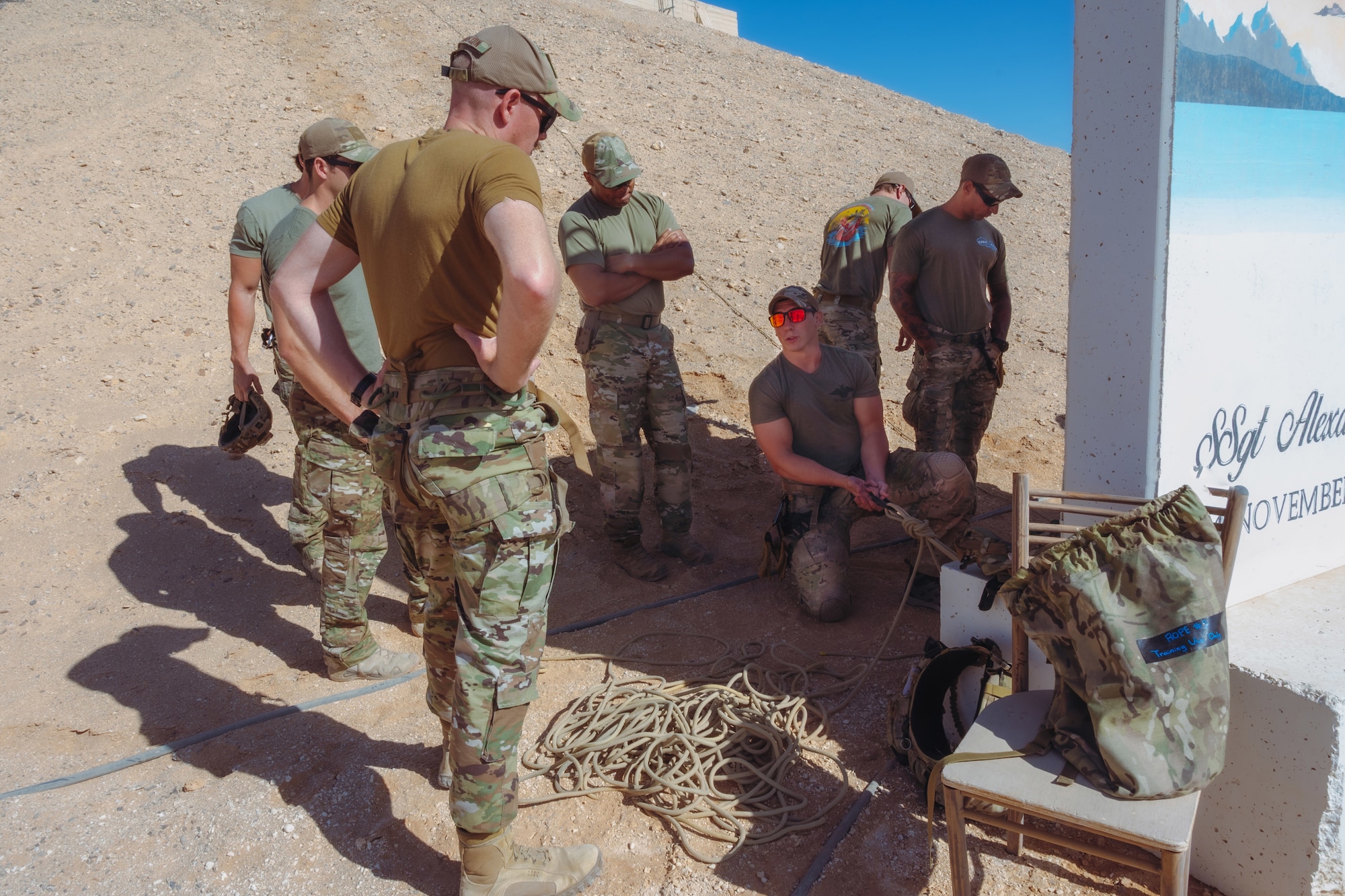 U.S. Air Force Personnel Recovery Task Force members assigned to the 52nd Expeditionary Rescue Squadron, showcase an anchor line system for a technical rescue and rappel operation, to U.S. Air Force Col. Jason Houston and 332d Air Expeditionary Wing leadership, as part of the “Red Tail Connection” program at an undisclosed location, September 28, 2022. These immersion visits provide greater insight into the unique skillsets every Airman brings to the 332d AEW Red Tail team. (U.S. Air Force photo by Tech. Sgt. Richard Mekkri)