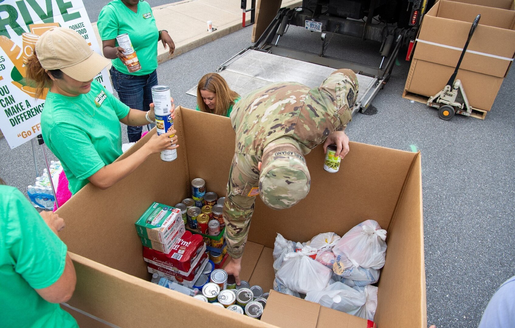 Military and civilian volunteers at a Stuff the Truck event at NSAW earlier this year.