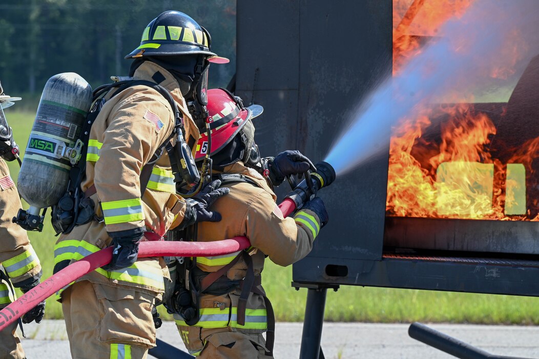 two put extinguish a simulated fire